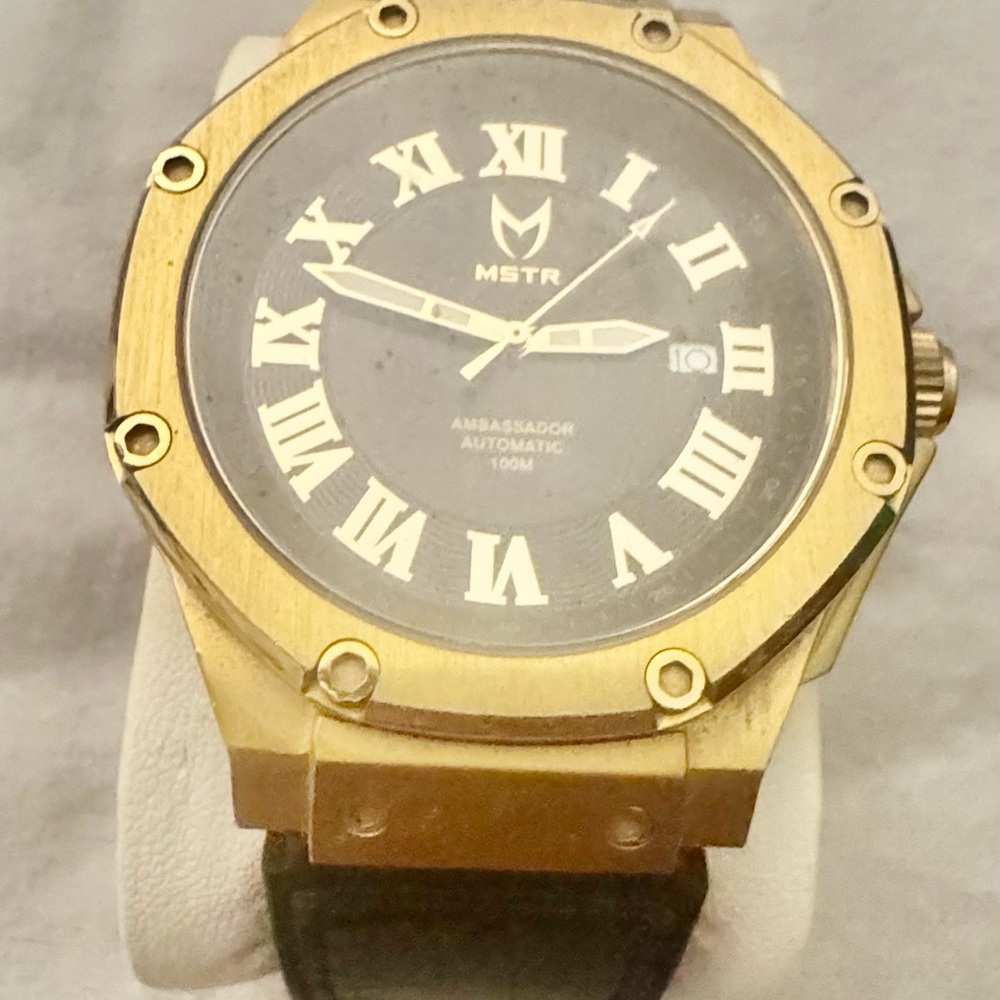MSTR Gold and Black Roman Numeral Watch
